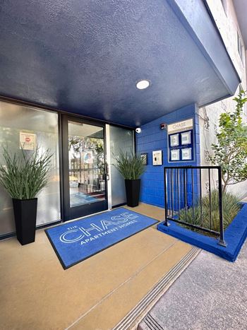 Covered entryway with blue tile accent wall
